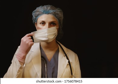 Doctor With Tired Eyes And Facial Wounds From A Medical Mask, Close-up. Nurse On A Black Background With Injury From A Protective Mask, Lifestyle.