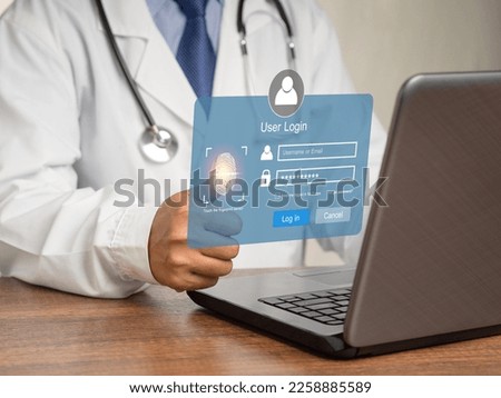 A Doctor in uniform accesses the system with a fingerprint on the virtual screen. A page for the login interface on the touch screen. Cyber security and personal data protection concept