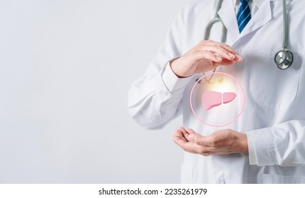 doctor in uniform hands holding liver organ virtual icon, female with hepatitis vaccination, liver cancer treatment. Health checkup concept.