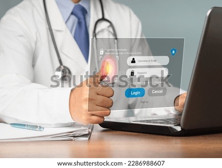 A doctor in uniform logs into the system using his fingerprint on the virtual screen. A page for the login interface. Concept of cyber security and personal data protection