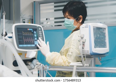 Doctor use monitor with vital signs for medical care of the flu covid19, corona virus, CRE. or VRE. infected elder patient 80s years old on patient bed in intensive care unit (ICU.) room at hospital - Shutterstock ID 1756489313