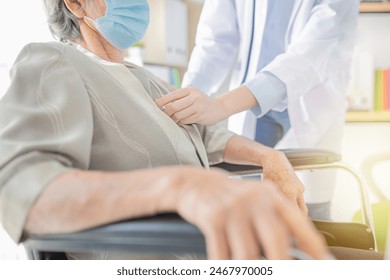 doctor use stethoscope listening lung of patient, elderly health check up, they wear surgical mask in hospital, respiratory disease protection - Powered by Shutterstock