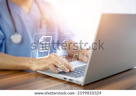 Doctor using computer Document Management System (DMS), online documentation database process automation to efficiently manage files