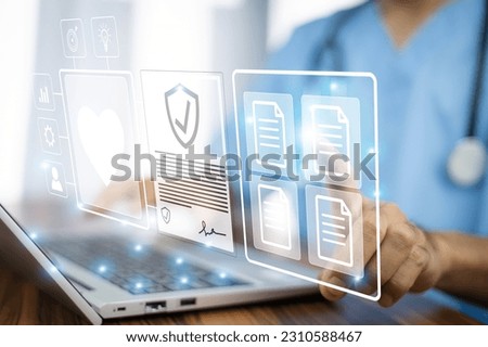 Doctor using computer Document Management System (DMS), online documentation database process automation to efficiently manage files	