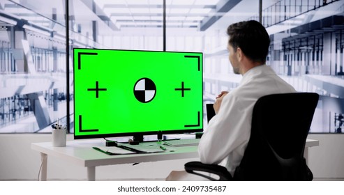 Doctor Using Desktop Computer With Green Screen - Powered by Shutterstock