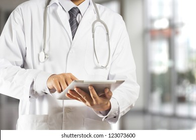 Doctor Using A Digital Tablet