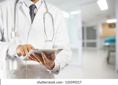 Doctor Using A Digital Tablet