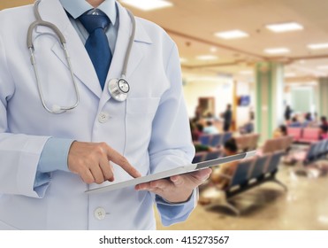 Doctor Using A Digital Tablet Computer In Hospital. Technology And Medical Concept.