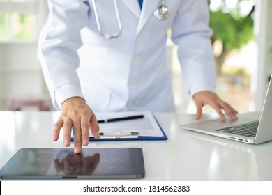 Doctor using digital tablet find information patient medical history at the hospital. Medical technology concept.