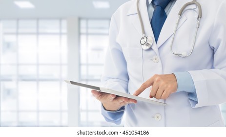 Doctor using digital tablet find information patient medical history at the hospital. Medical technology concept.

 - Powered by Shutterstock