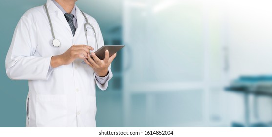 Doctor using a digital tablet working on hospital, Healthcare and Medicine 