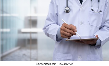 Doctor Using Electronic Pen On  Digital Tablet Writing Prescription On Digital Document With Hospital Background, Electronic Medical Record System, Health And Technology, Telemedicine Concept