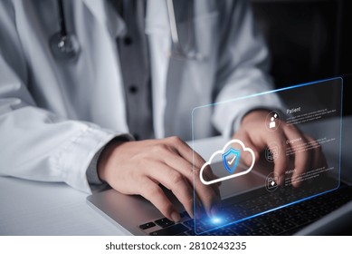 doctor using laptop computer typing accessing secure medical data cloud computing hologram shield protection electronic health record patient diagnosis history digital healthcare technology system