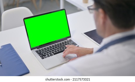 Doctor using Laptop with Green Chroma Screen - Powered by Shutterstock