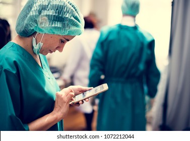 Doctor using mobile phone - Powered by Shutterstock