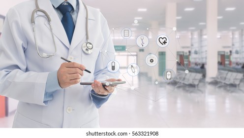 Doctor Using A Mobile Phone In Hospital. Concept Of Healthcare And Medical Network.