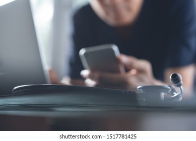 Doctor Using Mobile Smart Phone, Working On Laptop Computer In Medical Workspace Office With Stethoscope On Desk, Close Up, Electronic Health Records System, Telemedicine, Medical Technology Concept