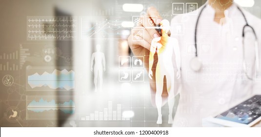 Doctor using modern computer with Medical record diagram on virtual screen concept. Health monitoring application. - Shutterstock ID 1200400918