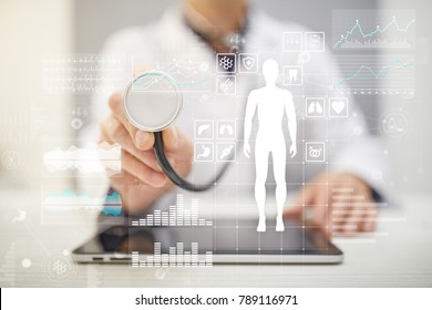 Doctor Using Modern Computer With Medical Record Diagram On Virtual Screen Concept. Health Monitoring Application.