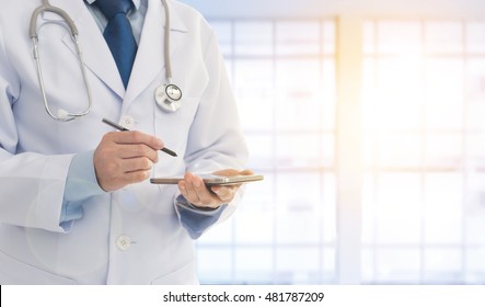 Doctor Using A Smart Phone In Hospital. Concept Of Doctor Appointment, Communication.