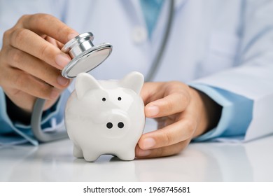 Doctor Using A Stethoscope To Check The Piggy Bank Financial Check-up, Concept Check Financial Sustainability Of Financial Status.