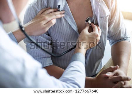 Doctor using a stethoscope checking patient with examining, presenting results symptom and recommend treatment method, Healthcare and medical concept.