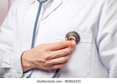 Doctor using stethoscope on himself. - Shutterstock ID 305816315