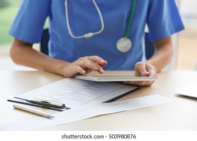Doctor using tablet in office