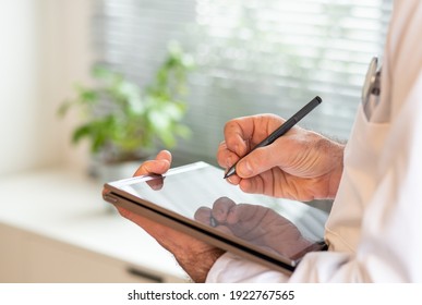 doctor using tablet telemedicine telehealth concept - Shutterstock ID 1922767565