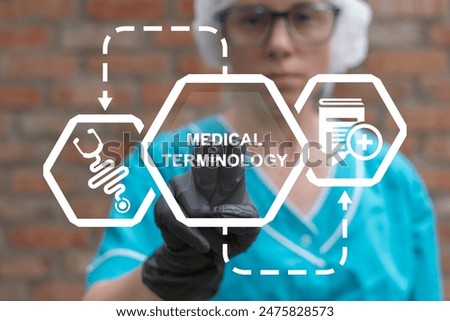 Doctor using virtual touch screen presses inscription: MEDICAL TERMINOLOGY. Health and Medical Education Science Concept - Medical Terminology. Medicine terms.