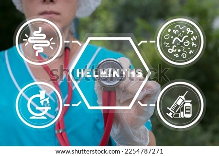 Doctor using virtual touchscreen presses word: HELMINTHS. Helminths treatment concept. Intestine, stomach doctors examine, treat dysbiosis, give medical supplies against worms.