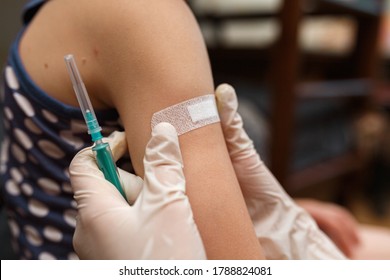 Doctor vaccinated in shoulder. Promotion disease prevention. Medical syringe with vaccine. Accidental injection. Fight against diseases, vaccine against covid 19. Injection from coronavirus concept.