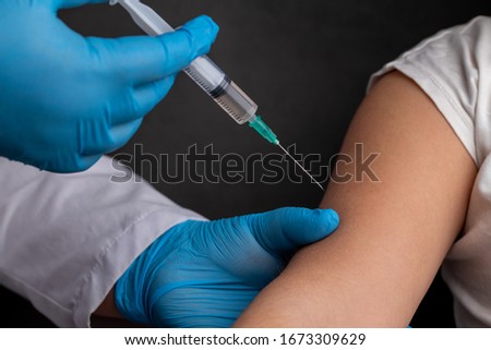 Doctor vaccinates child to stop coronavirus and other pandemic diseases