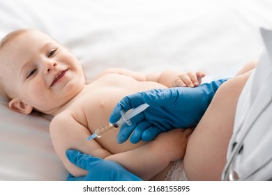 Doctor vaccinating baby in clinic. Little baby get an injection. Pediatrician vaccinating newborn baby. Vaccine for infant child. Child's Immunization, Children's Vaccination, Health concept.