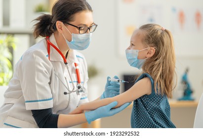 Doctor Vaccinating Child At Hospital.