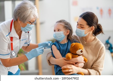 Doctor Vaccinating Child, Kid With Mother At Hospital.