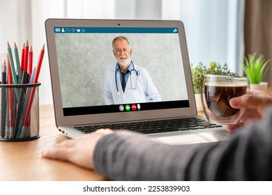 Doctor video call online by modish telemedicine software application for virtual meeting with patient - Shutterstock ID 2253839903