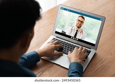 Doctor video call online by modish telemedicine software application for virtual meeting with patient - Powered by Shutterstock