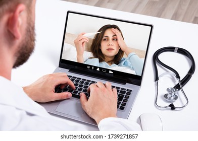 Doctor In Video Conference Call With Sick Patient