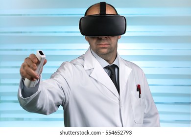 Doctor In Virtual Medical Tour With VR Virtual Reality Glasses / Researcher Wearing Virtual Reality Glasses Conducting A Work Remote