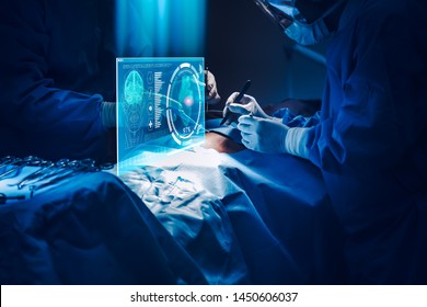 Doctor with virtual reality in operation room in hospital.Surgeon analyzing patient heart testing result and human anatomy on technological digital futuristic virtual interface,digital holographic. - Powered by Shutterstock