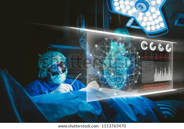 Doctor with virtual reality in operation\
room in hospital.Surgeon analyzing patient heart testing result and\
human anatomy on technological digital futuristic virtual\
interface,digital\
holographic.