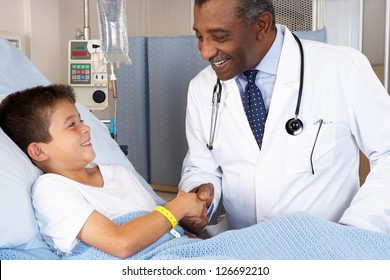 Doctor Visiting Child Patient On Ward