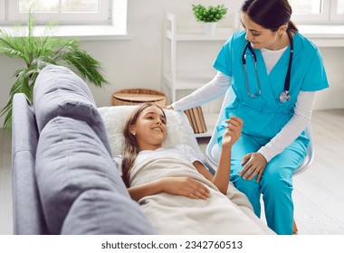 Doctor visits a sick child patient at home. Friendly woman pediatrician in scrubs visits a little girl to check on her during her illness. Health care, sickness, medical checkup concept - Powered by Shutterstock