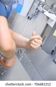 Doctor Washes His Arms Before Surgery.