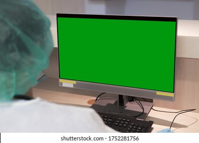 Doctor Watching The Green Screen Monitor Computer In Covid-19 Ward