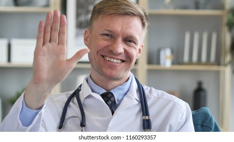 Doctor Waving Hand To Welcome