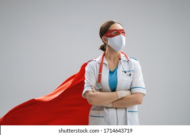 Doctor wearing facemask and superhero cape during coronavirus outbreak. Virus and illness protection, quarantine. COVID-2019. Super hero power for  medicine.