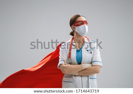 Doctor wearing facemask and superhero cape during coronavirus outbreak. Virus and illness protection, quarantine. COVID-2019. Super hero power for  medicine.