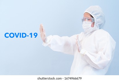 A Doctor Wearing Personal Protective Equipment Including Mask, Goggle, And Suit To Protect And Stop COVID-19 Infection. Coronavirus, Medical, Quarantine, Healthcare Concept